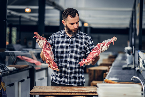 bearded-butcher-dressed-fleece-shirt-working-butchers-shop